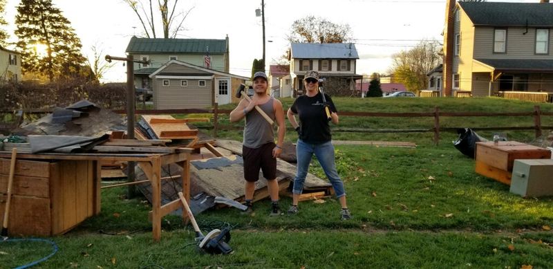 Bryce Barnes helping a first time home buyer tear down a shed to pass inspection Franklin County PA