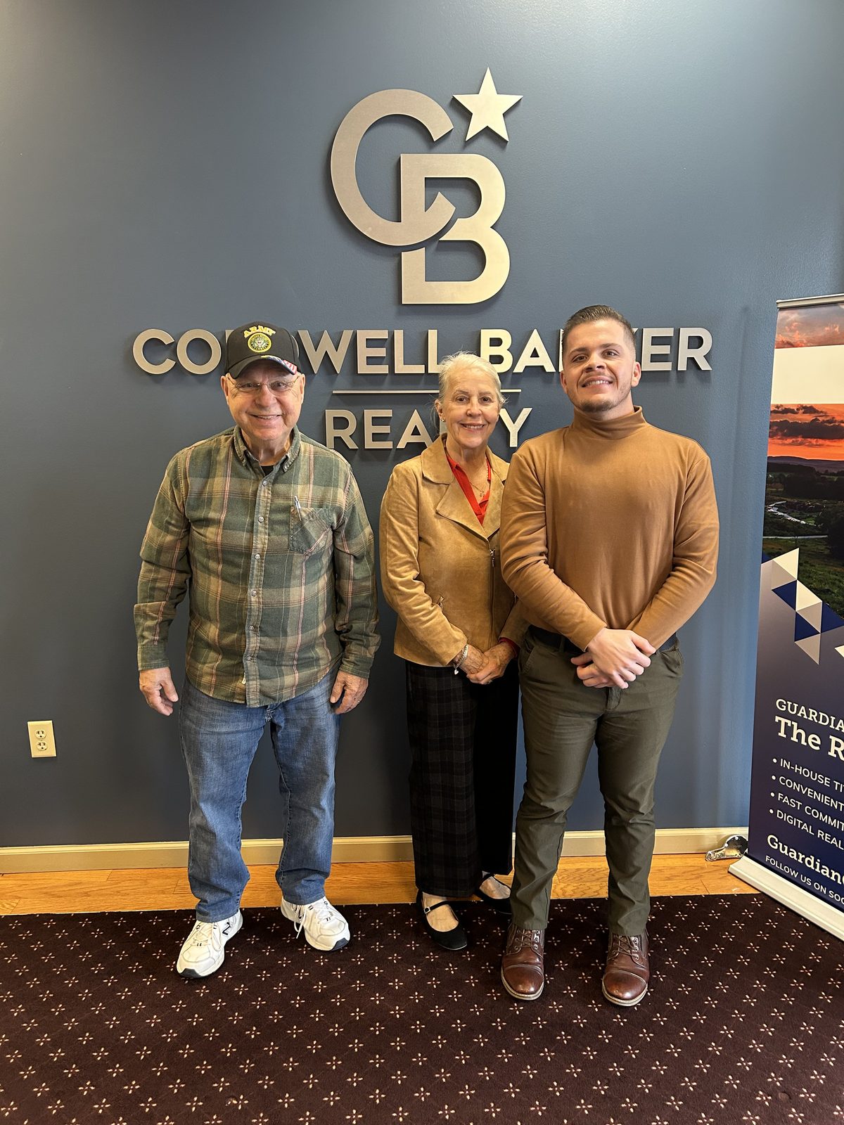 Bryce Barnes with clients at Coldwell Banker Realty Chambersburg PA office